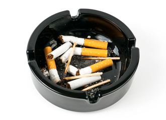 Ashtray with butts over white