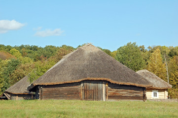 Ancient traditional ukrainian rural barn with a straw roof