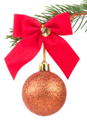 Christmas ball with a bow on a fir tree branch