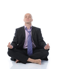 businessman meditating in yoga lotus