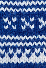 Blue knitting background of handmade woolen pattern