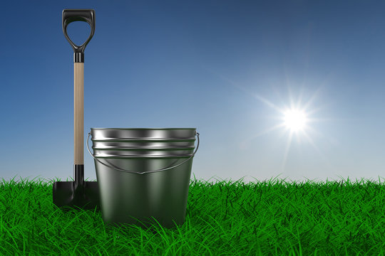 Shovel and bucket on grass. garden tool. 3D image