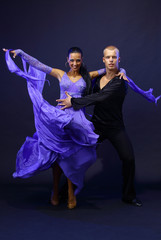 dancers against black background
