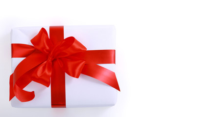 gift wrapped with a red ribbon on a white background.