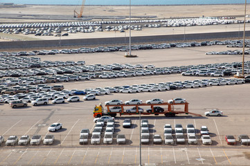 Big warehouse of cars on sunny day