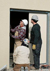 Workers Repairing Door