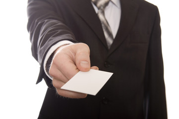 Business man handing a blank business card over white