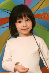 Beautiful girl with multicolored umbrella