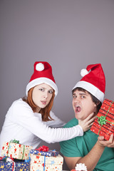 Girl strangling her boyfriend for a christmas gift.