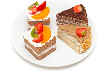 pieces of cake on a plate isolated on white background