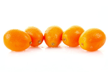 few kumquates  isolated on white