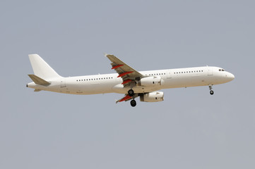 White plane prepared to land