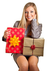 Blond caucasian woman in formal dress with gift boxes isolated