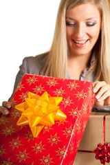 Blond caucasian woman in formal dress with gift boxes isolated