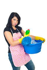 Miffed woman holding cleaning products - obrazy, fototapety, plakaty