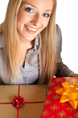 Blond caucasian woman in formal dress with gift boxes isolated