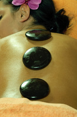 Young Woman and Stone Massage
