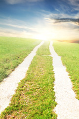 road in landscape leads to sky