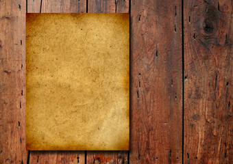 Old paper over an old wood background