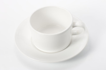 Obraz na płótnie Canvas empty white mug on saucer