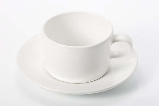 empty white mug on saucer