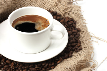 mug of coffee beans and hessian