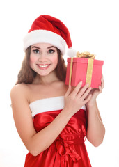 Cheerful santa helper girl with big gift box.