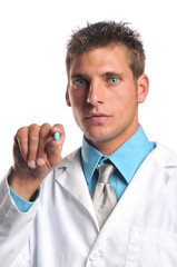 Doctor holding a pill