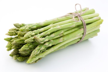 Sheaf of asparagus on a white background.