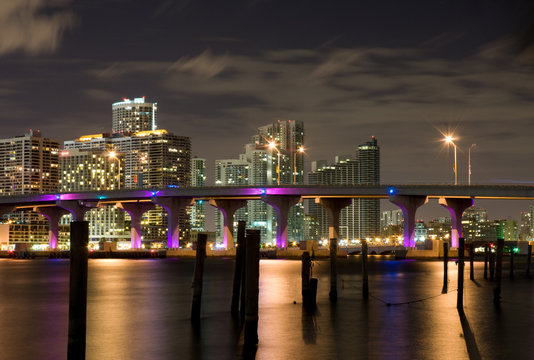 City Skyline at Night with Bridge