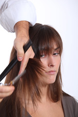 Fototapeta premium Closeup of woman having an haircut