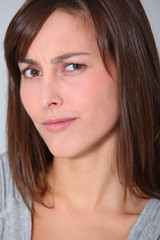 Young woman with doubtful look