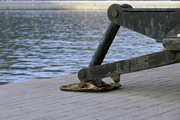 Detail of a metal crane base on the jetty