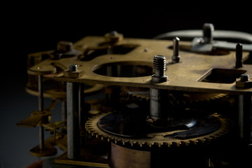 Clockwork over dark background