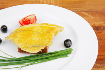 fish fillet with tomatoes,chives and bread
