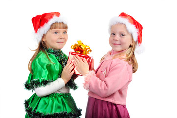 The girl gives to the girlfriend a gift for Christmas