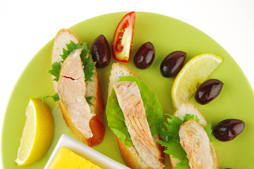 salmon pieces on baguette slices