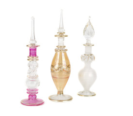 Three perfume bottles, isolated on white background.