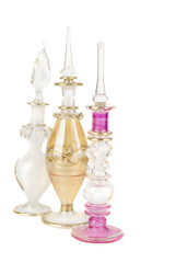 Three perfume bottles, isolated on white background.