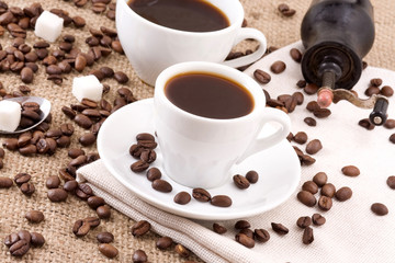 beans, sugar and cup of coffee on sack