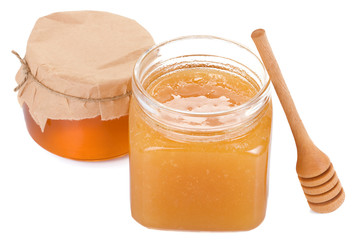 honey in glass jars isolated on white