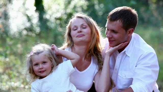 Young family enjoying leisure time together in the park