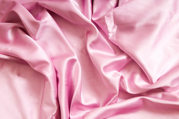 Obraz premium Bright satin fabric folded to be used as background