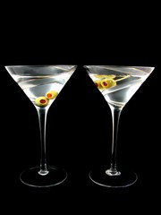 Two martini's isolated on black background