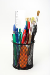 Pen and pencil in holder white background