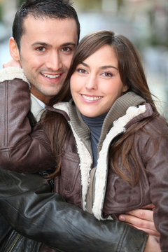 Young couple shopping in town in winter
