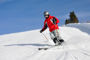 Young boy skiing on mountains