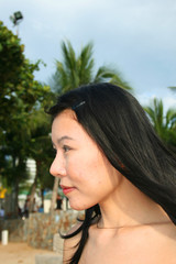 Asian girl on south Pattaya beach, Thailand.