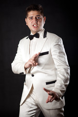 compere man in an overwhites with a butterfly in appearance