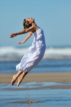 young woman on the beach in summer